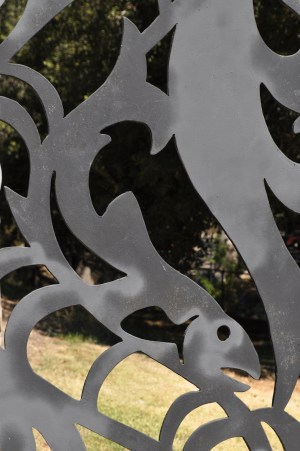 A steelhead rendered on the Guardians of the River gate. Once these oceangoing trout ran up the river. Time for them to return.