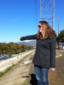 U.S. Army Corps biologist Erin Jones points to one of the soft-bottom areas of the Los Angeles River near North Atwater Park. (Jim Burns)