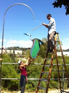 WINGING IT: Two locals affix this beautiful rendition of a Great Blue Heron, a reminder of all things riverly. (Jim Burns)